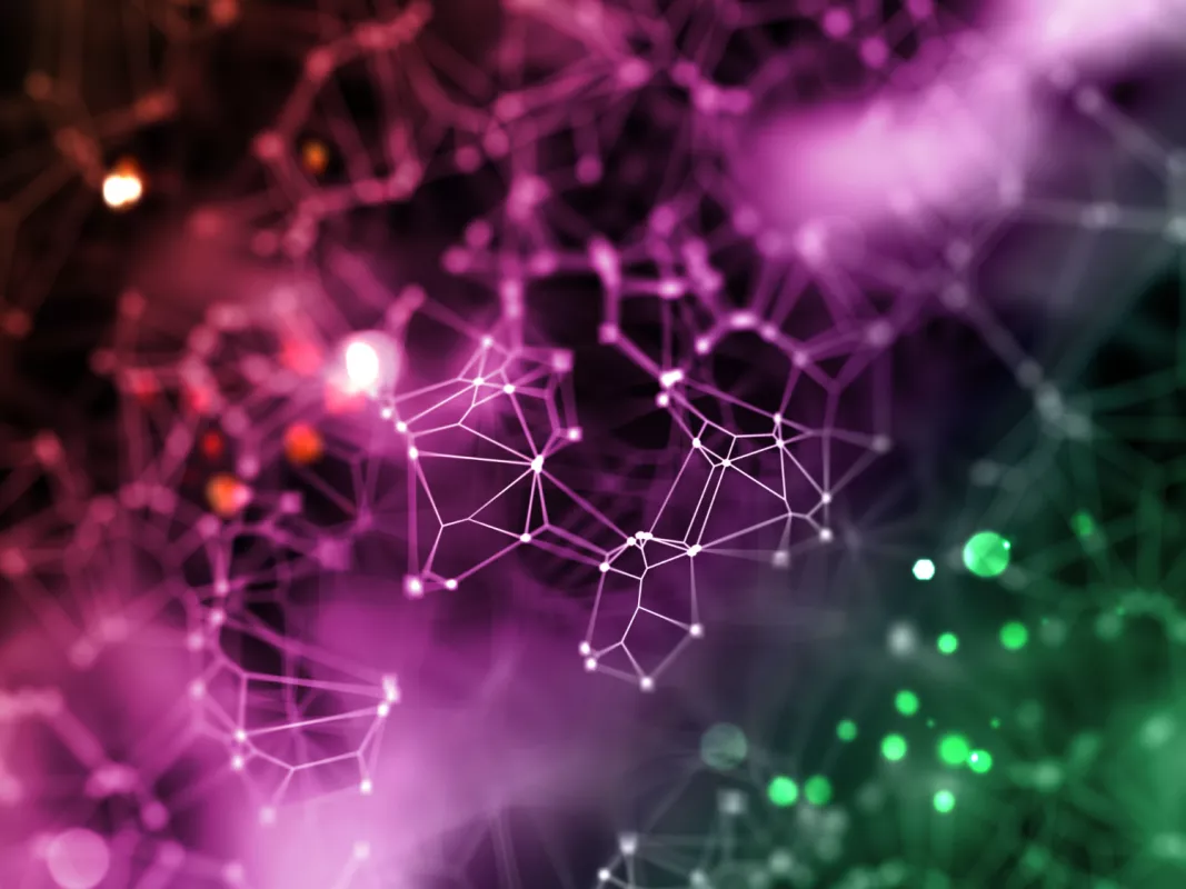 Abstract network of interconnected nodes in purple-green gradient, symbolizing complex systems.