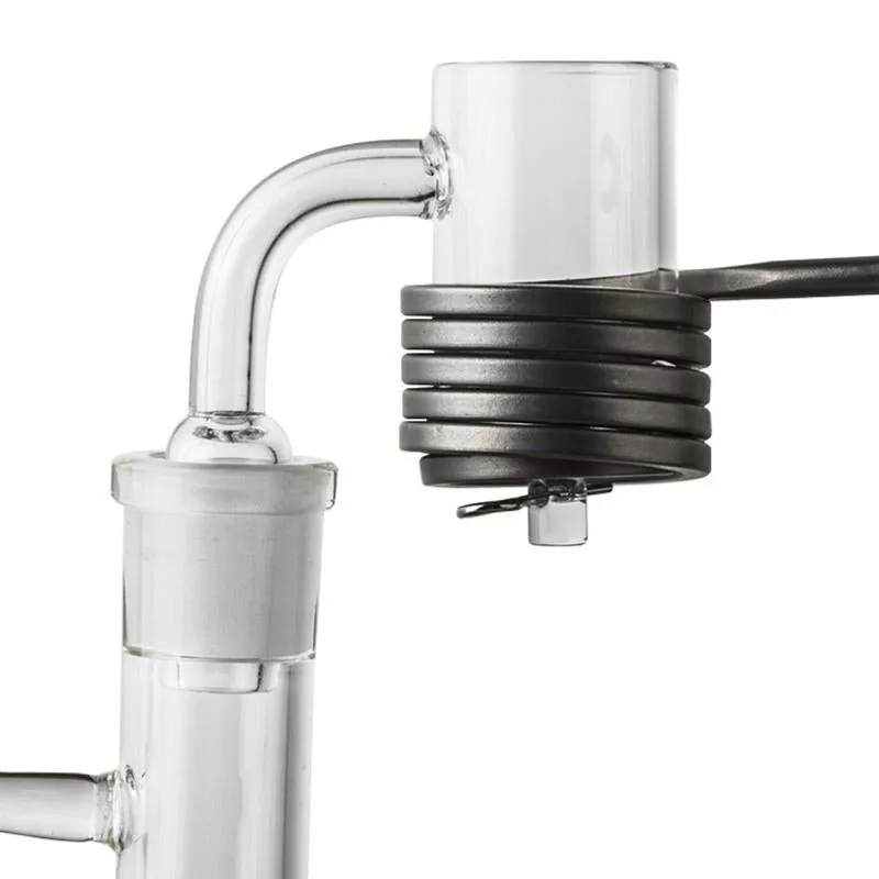 Glass lab condenser with cooling coil for chemical distillation and temperature control.