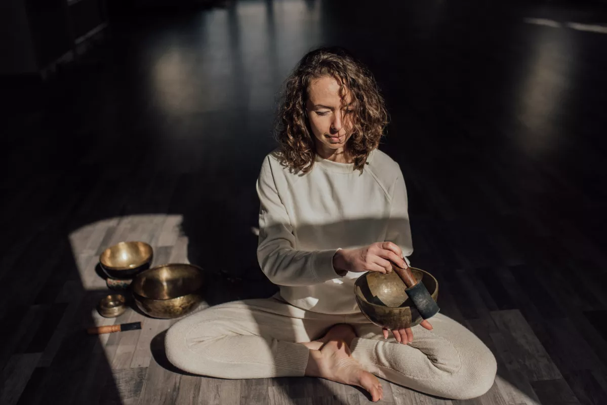 Meditative practice with Tibetan singing bowls for relaxation and stress relief.