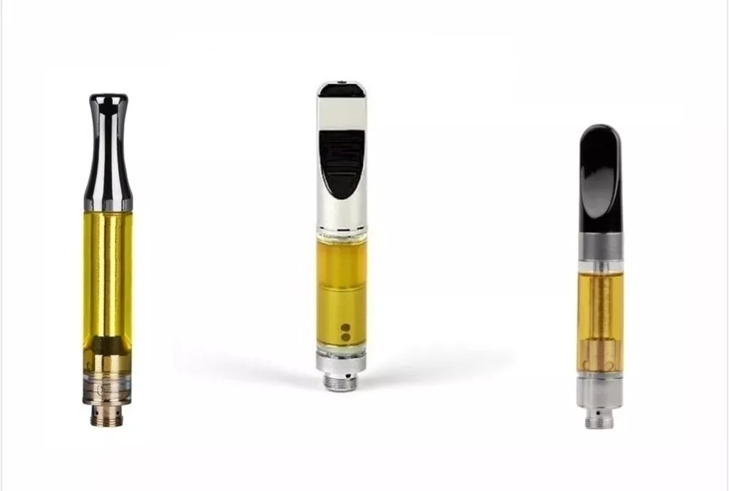 Assorted vape pen cartridges with clear tanks and different mouthpiece designs.