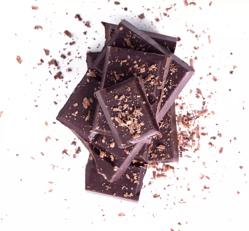Stacked glossy dark chocolate pieces, rich in antioxidants, ideal for culinary use and health benefits.