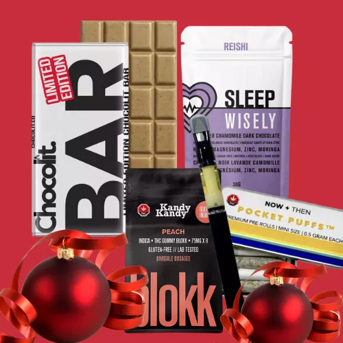 Chocolate bars and snacks on a red background with holiday ornaments.