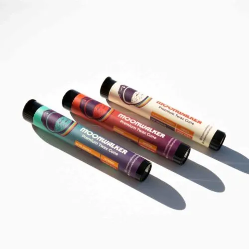 Moonquake skincare tubes with lunar designs on textured background.